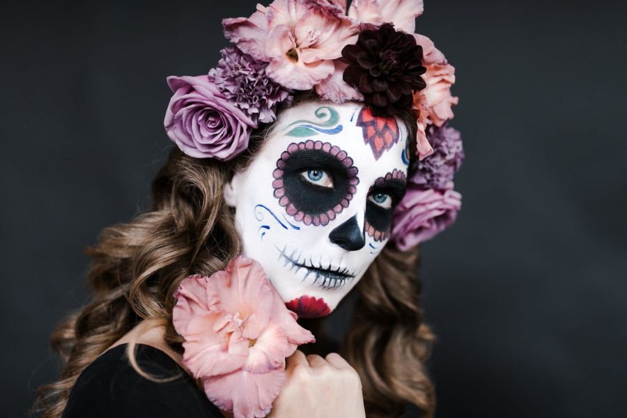 woman with candy skull visage for day of dead