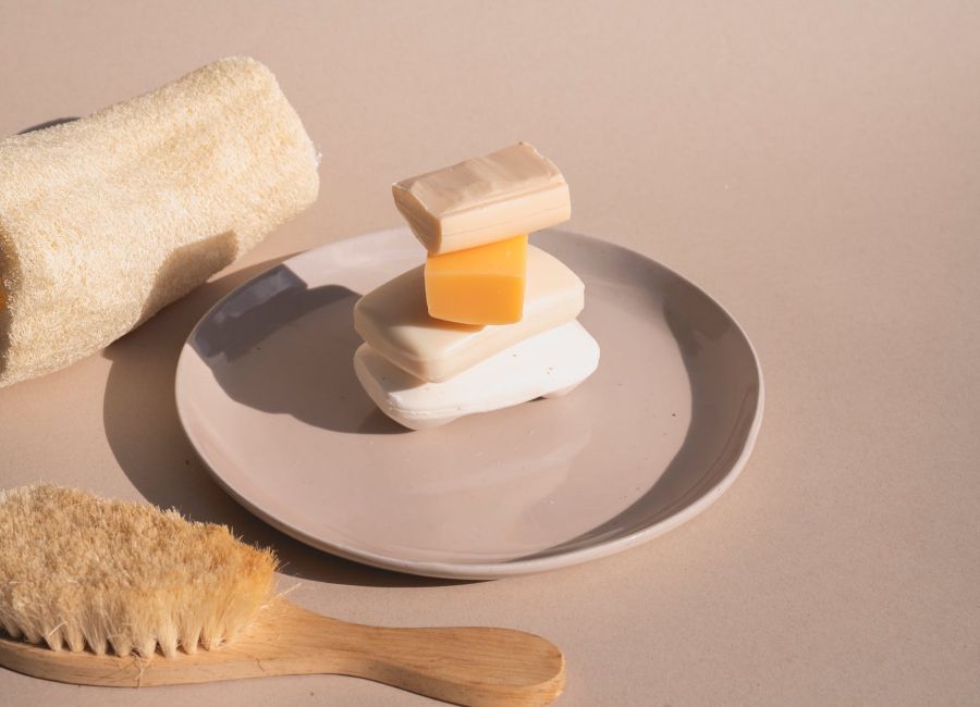 a stack of bar soaps on ceramic plate