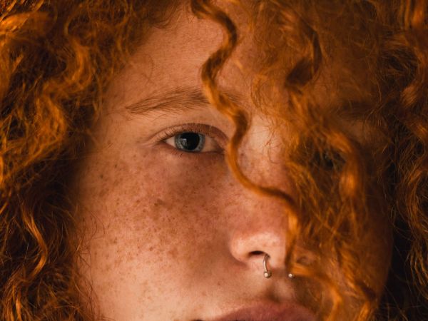 close up photo of person with nose ring