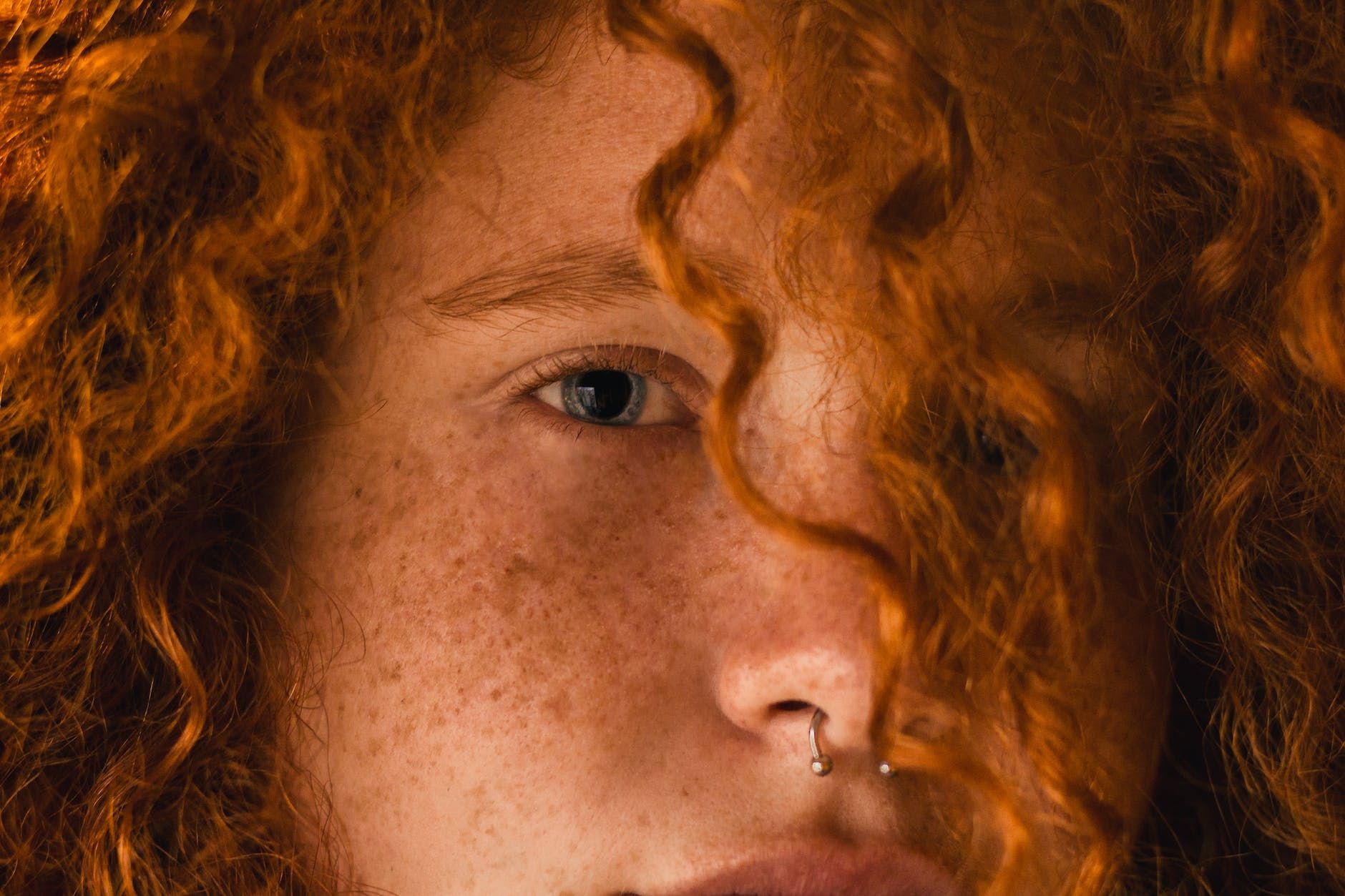 close up photo of person with nose ring