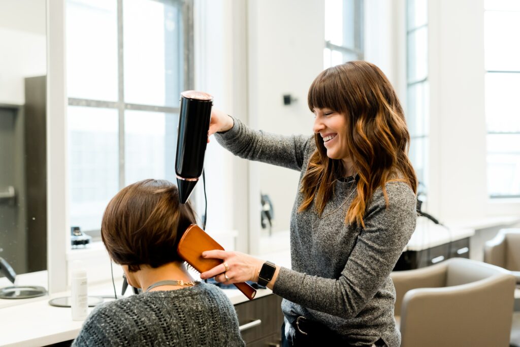 Woman receiving a keratin treatment at a salon, showcasing the professional care for strong and healthy hair