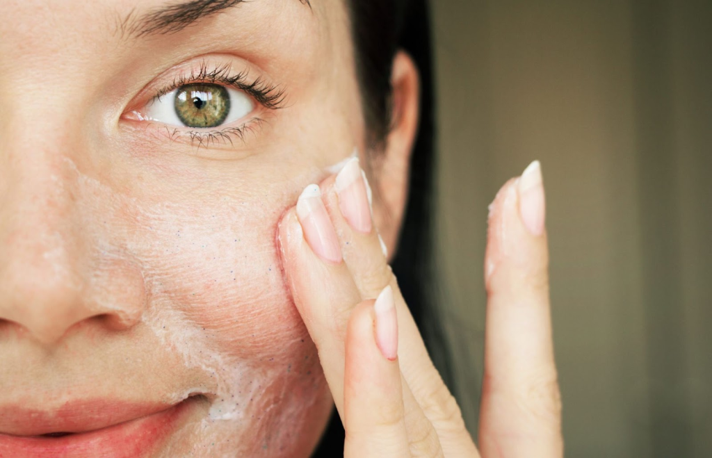 applying cream on face