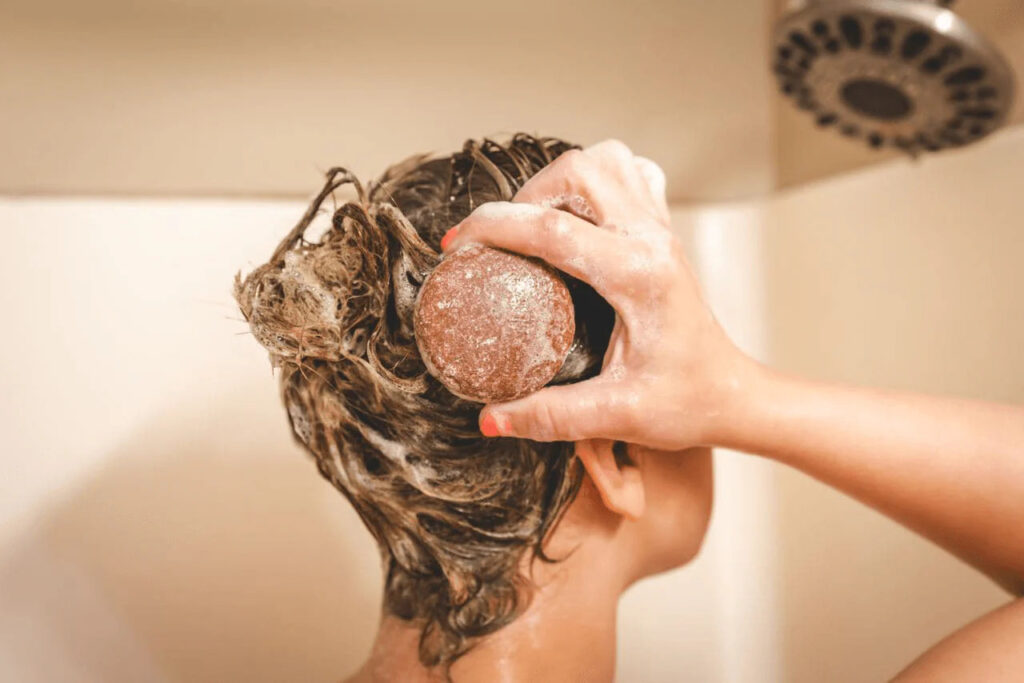 Polygonum Shampoo Bar purcorganics shampoo bar woman using shampoo bar